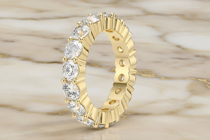 Round brilliant natural diamond eternity band in 14K white gold — profile