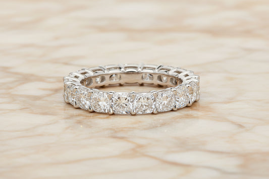 Cushion cut lab diamond eternity band in 14K white gold — front