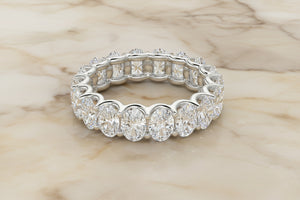Oval cut lab diamond eternity band in 14K white gold — front