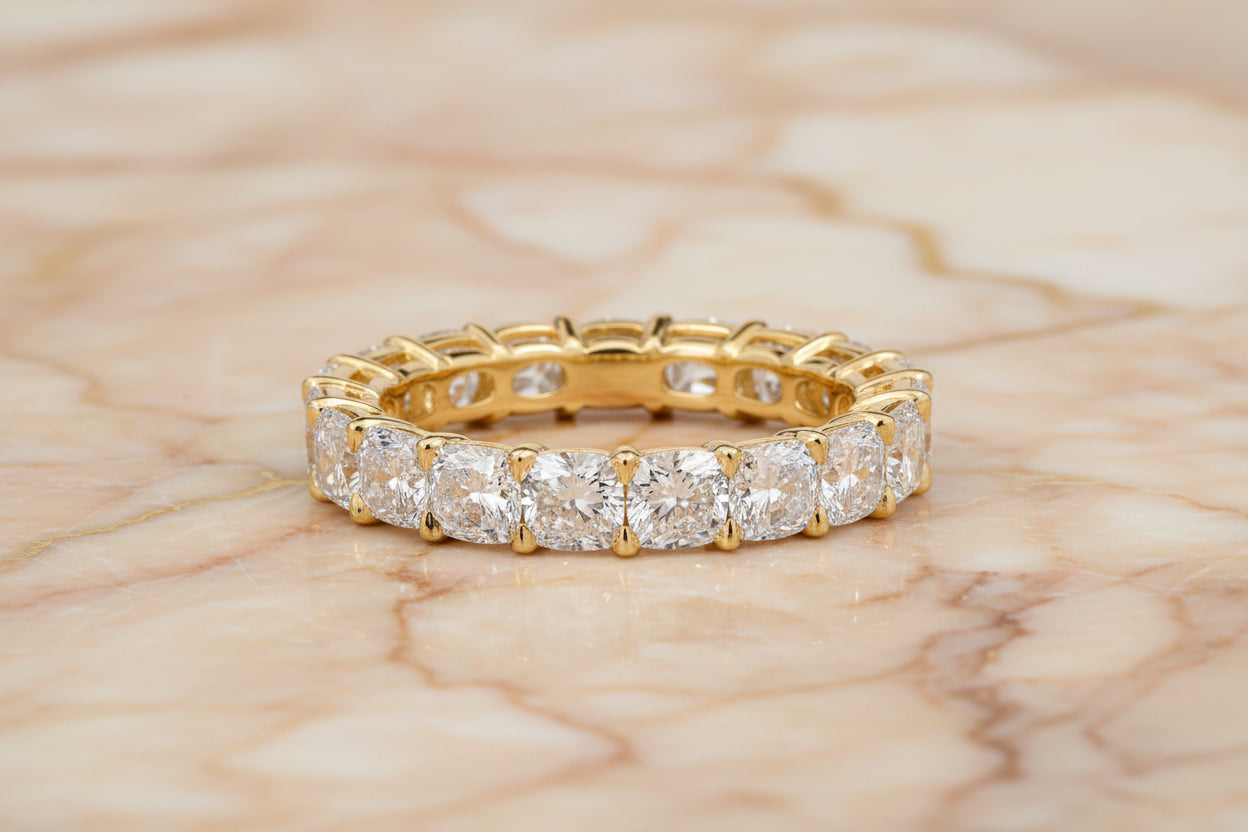 Cushion cut natural diamond eternity band in 14K yellow gold — front
