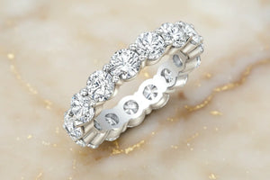 Round brilliant natural diamond eternity band in 14K yellow gold, front