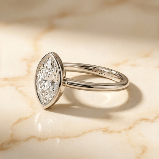 The Agnes bezel solitaire marquise engagement ring setting in platinum — alt-angle hero — RockHer