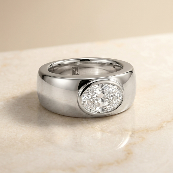 The Remi Select — Bezel-Set Cigar Band Oval in 18K Yellow Gold