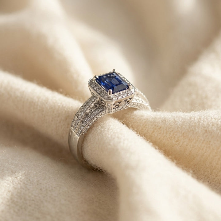 Sapphire Emerald Cut & Diamond Halo Ring in 14K White Gold - flat lay