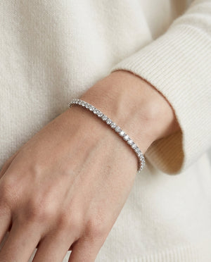 Diamond 4-prong Tennis Bracelet In Platinum (3mm), worn close-up portrait