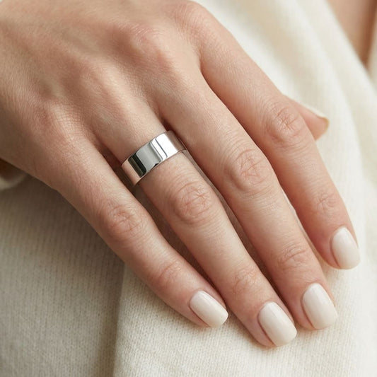 4mm Flat Comfort-Fit Wedding Band in Platinum, worn on hand, close-up