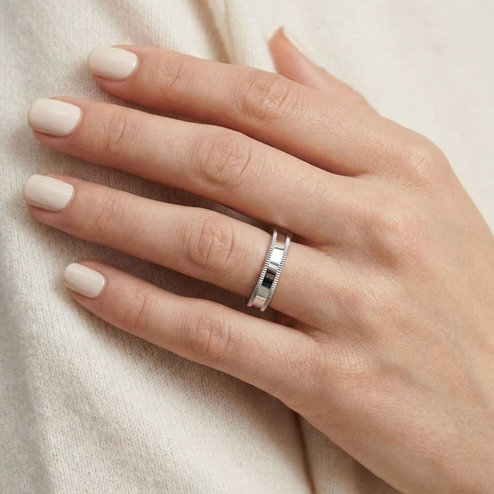 4mm Flat Milgrain Comfort-Fit Wedding Band in Platinum, worn on hand, close-up