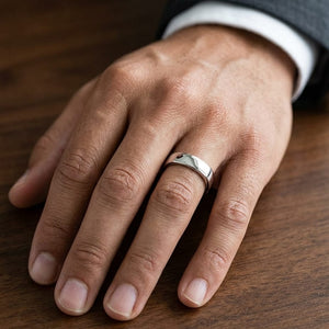 5.5mm Deluxe Comfort-Fit Wedding Band in Platinum, worn on hand, masculine close-up