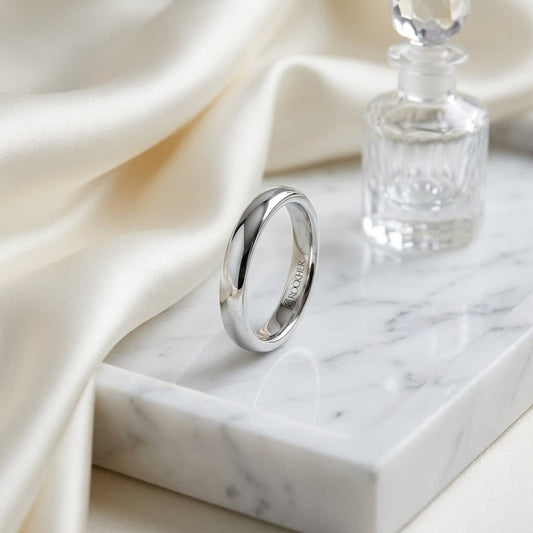 3mm High Dome Comfort-Fit Wedding Band in Platinum, on marble vanity tray with silk