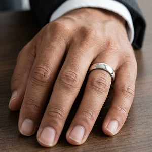 7mm High Dome Comfort-Fit Wedding Band in Platinum, worn on hand, masculine close-up