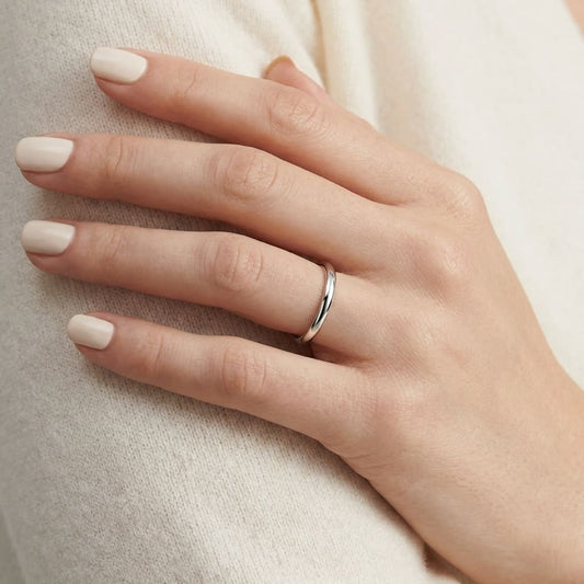 2mm Slightly Domed Comfort-Fit Wedding Band in Platinum, worn on hand, close-up