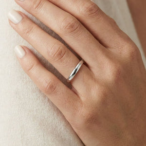 2.5mm Slightly Domed Comfort-Fit Wedding Band in Platinum, worn on hand, close-up