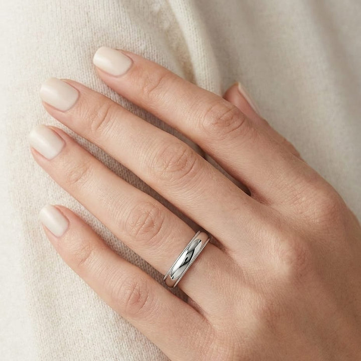 4mm Slightly Domed Double Milgrain Comfort-Fit Wedding Band in Platinum, worn on hand, close-up