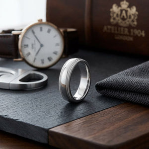 6mm Slightly Domed Double Milgrain Comfort-Fit Wedding Band in Platinum, on walnut surface with pocket square