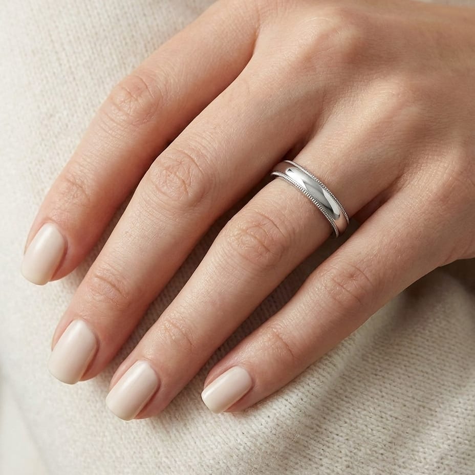 4mm Slightly Domed Super Light Milgrain Comfort-Fit Wedding Band in Platinum, worn on hand, close-up