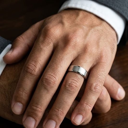 7mm Satin Finish High Polished Beveled Edge Carved Wedding Band in Platinum, worn on hand, masculine close-up