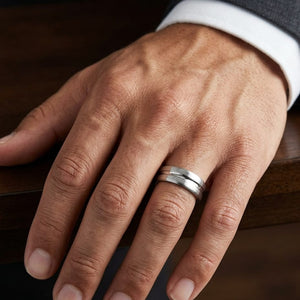 7.5mm Satin Finish High Polished Center Cut Carved Wedding Band in Platinum, worn on hand, masculine close-up