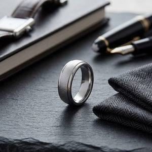 6mm Wired Finish High Polished Round Edge Carved Wedding Band in Platinum, on walnut surface with pocket square