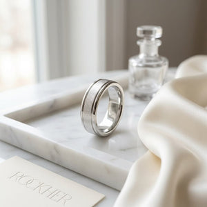 4mm Wired Finish High Polished Round Edge Carved Wedding Band in Platinum, on marble vanity tray with silk