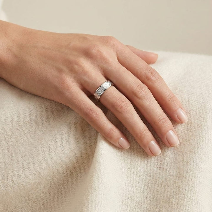 4mm Hammered Finish Carved Wedding Band in Platinum, worn on hand, full view