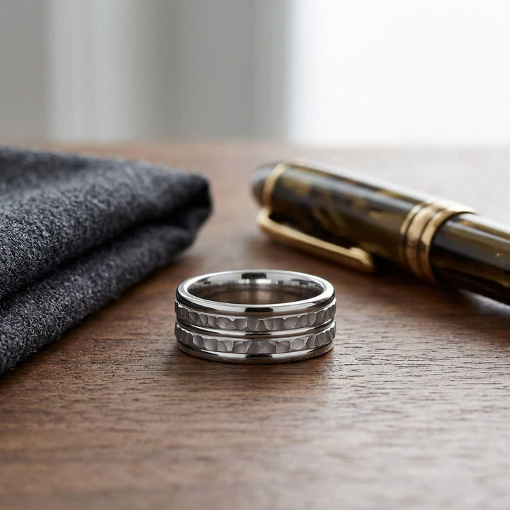 7.5mm High Polish Round Edge Carved Wedding Band in Platinum, on walnut surface with pocket square