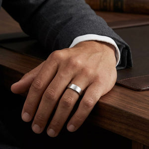 7.5mm Satin Finish Carved Wedding Band in Platinum with Yellow Gold, worn on hand, masculine full view