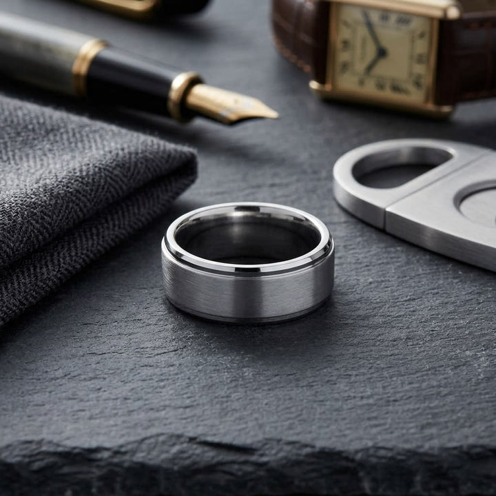 8mm Satin Finish High Polished Beveled Edge Carved Wedding Band in Platinum, on walnut surface with pocket square