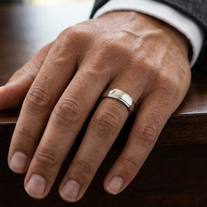 6.5mm Drop Edge High Polish Carved Wedding Band in Platinum, worn on hand, masculine close-up