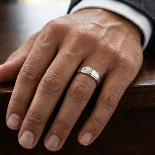 6.5mm Drop Edge High Polish Carved Wedding Band in Platinum, worn on hand, masculine close-up