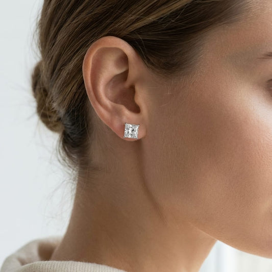 Natural Diamond Round Brilliant Three Prong Martini Stud Earrings in Platinum, 1 ct. t.w., worn close-up portrait