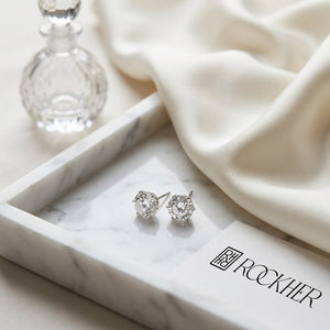 Natural Diamond Round Brilliant Stud Earrings in Platinum, 1 ct. t.w., on marble vanity tray with silk