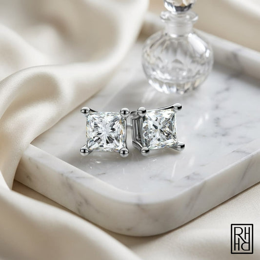Platinum 4-prong Princess Diamond Stud Earrings (0.25 Ct. T.w., Vs1-vs2 Clarity, F-g Color), on marble vanity tray with silk