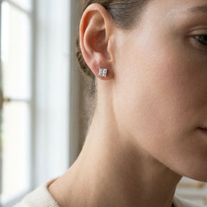 Platinum 4-prong Princess Diamond Stud Earrings (0.25 Ct. T.w., Vs1-vs2 Clarity, F-g Color), worn close-up portrait