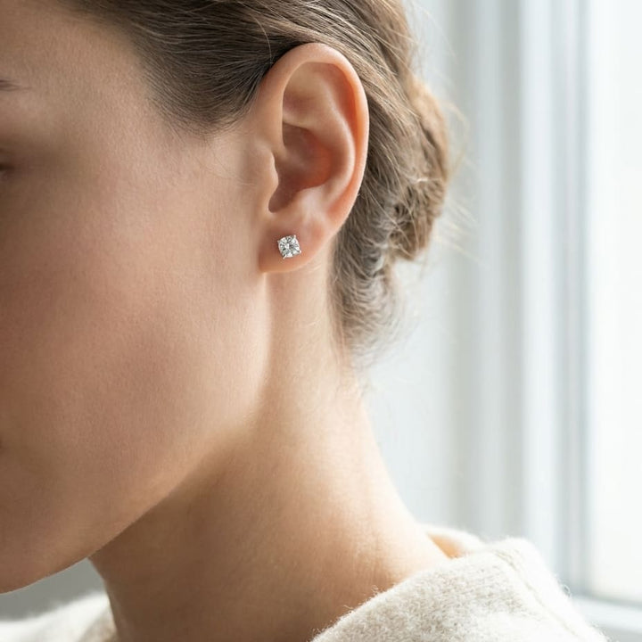 Natural Diamond Round Brilliant Four Prong Stud Earrings in Platinum, 1 ct. t.w., worn close-up portrait