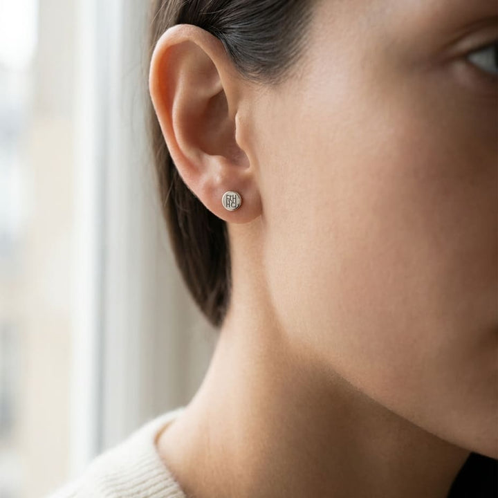 Natural Diamond Round Brilliant Bezel Stud Earrings in Platinum, 2 ct. t.w., worn close-up portrait