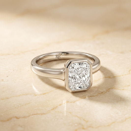 The Agnes bezel solitaire radiant engagement ring setting in platinum — alt-angle hero — RockHer