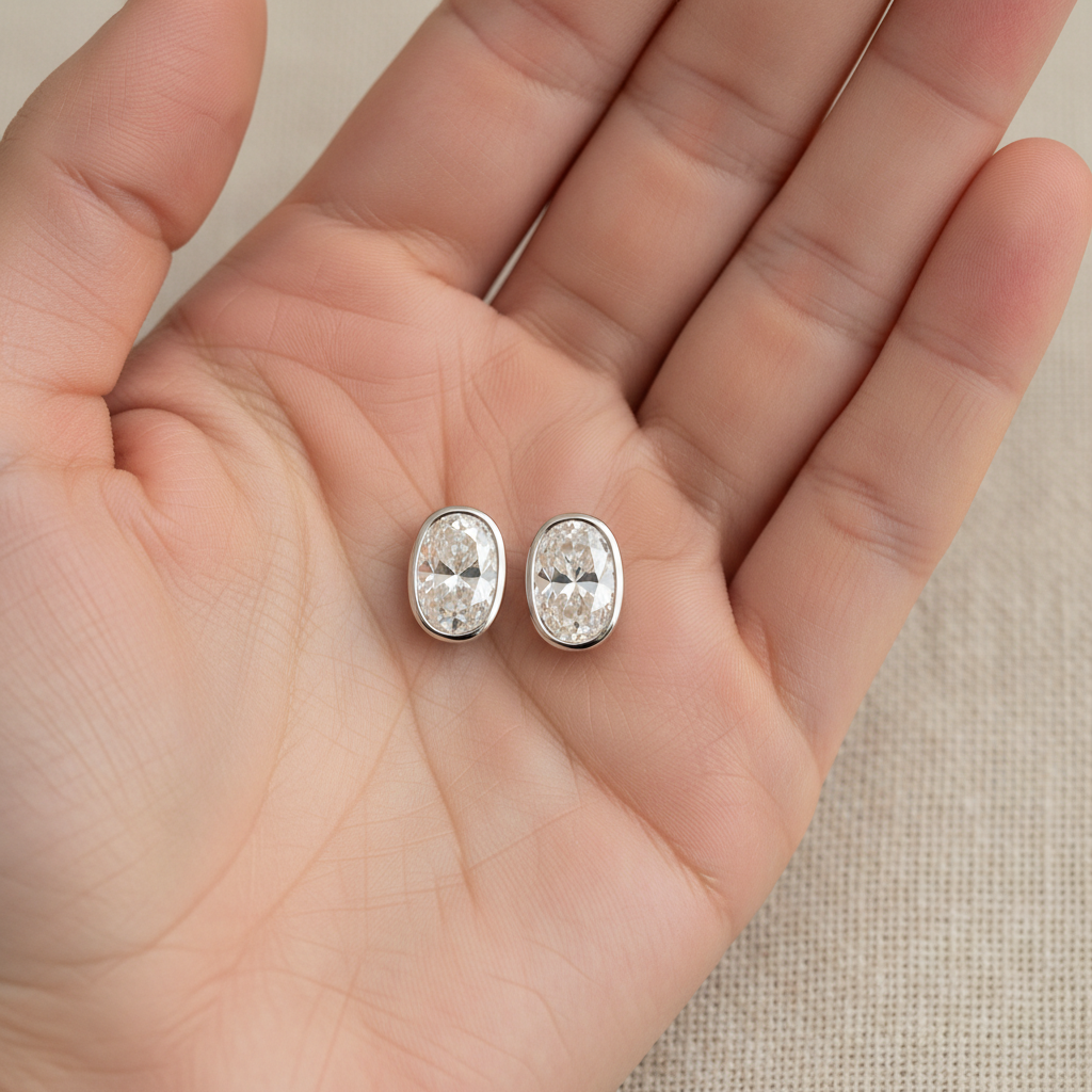 Natural Diamond Oval Bezel Stud Earrings · 1ct tw — hand full — 14K White Gold