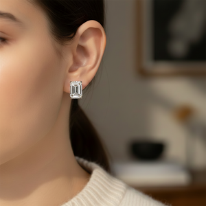 Emerald cut lab diamond stud earrings, four-prong basket, platinum, close portrait view