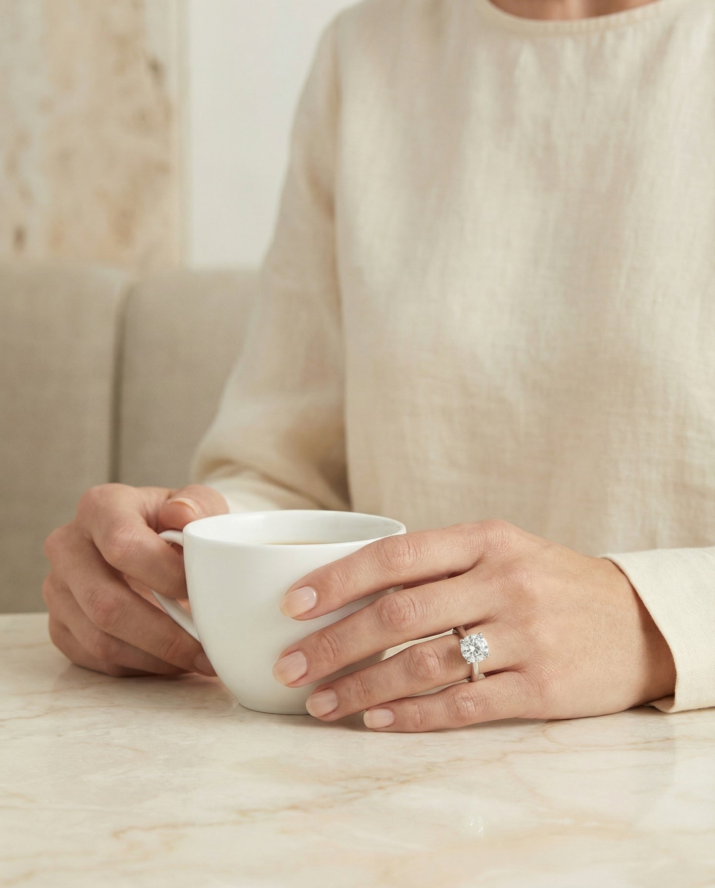 Secret Halo Adorned Prong Solitaire Cushion, in Platinum – lifestyle shot | RockHer