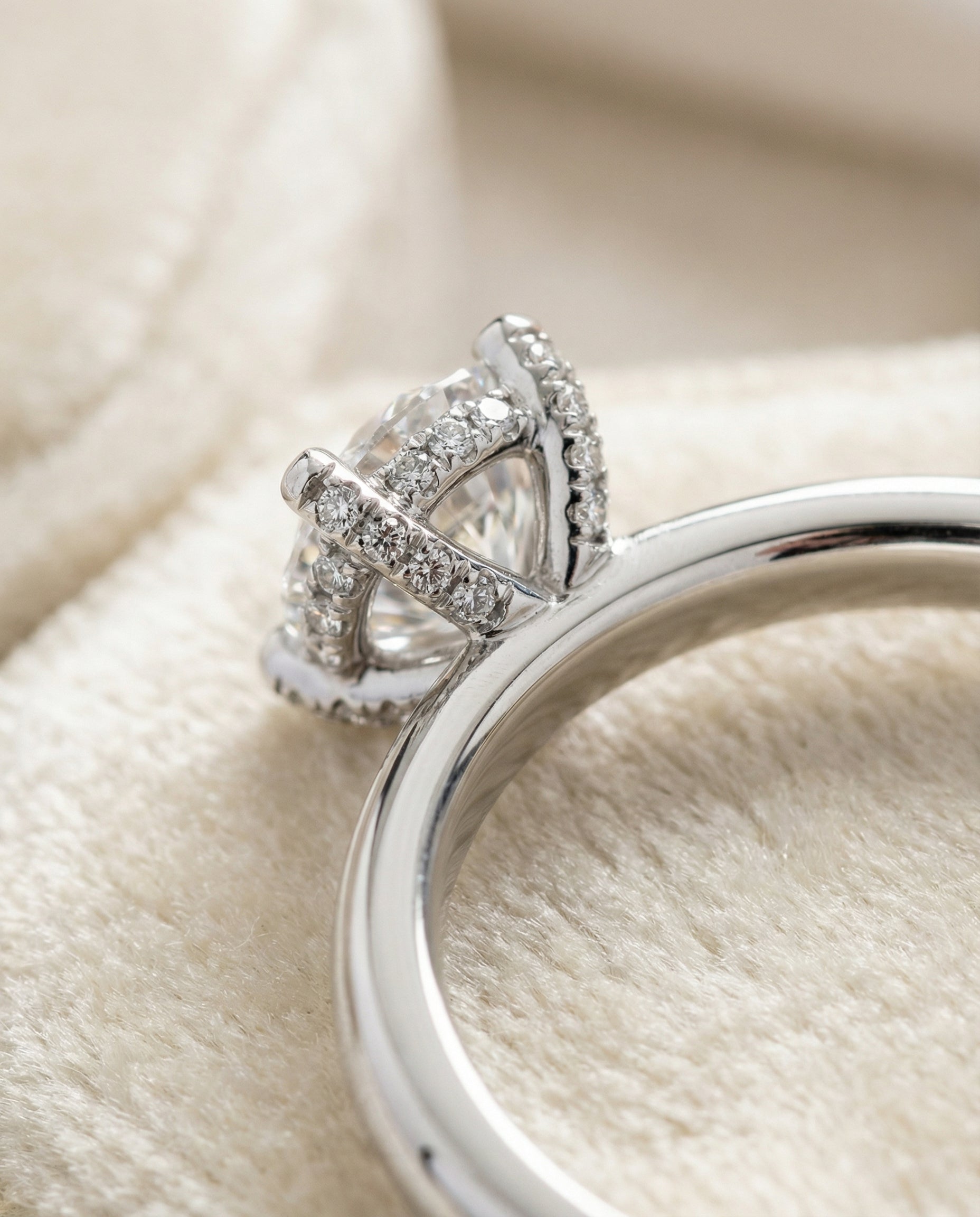 Lana Select Secret Halo Adorned Prong Solitaire Cushion Cut Lab Diamond Engagement Ring in Platinum, detail view | RockHer