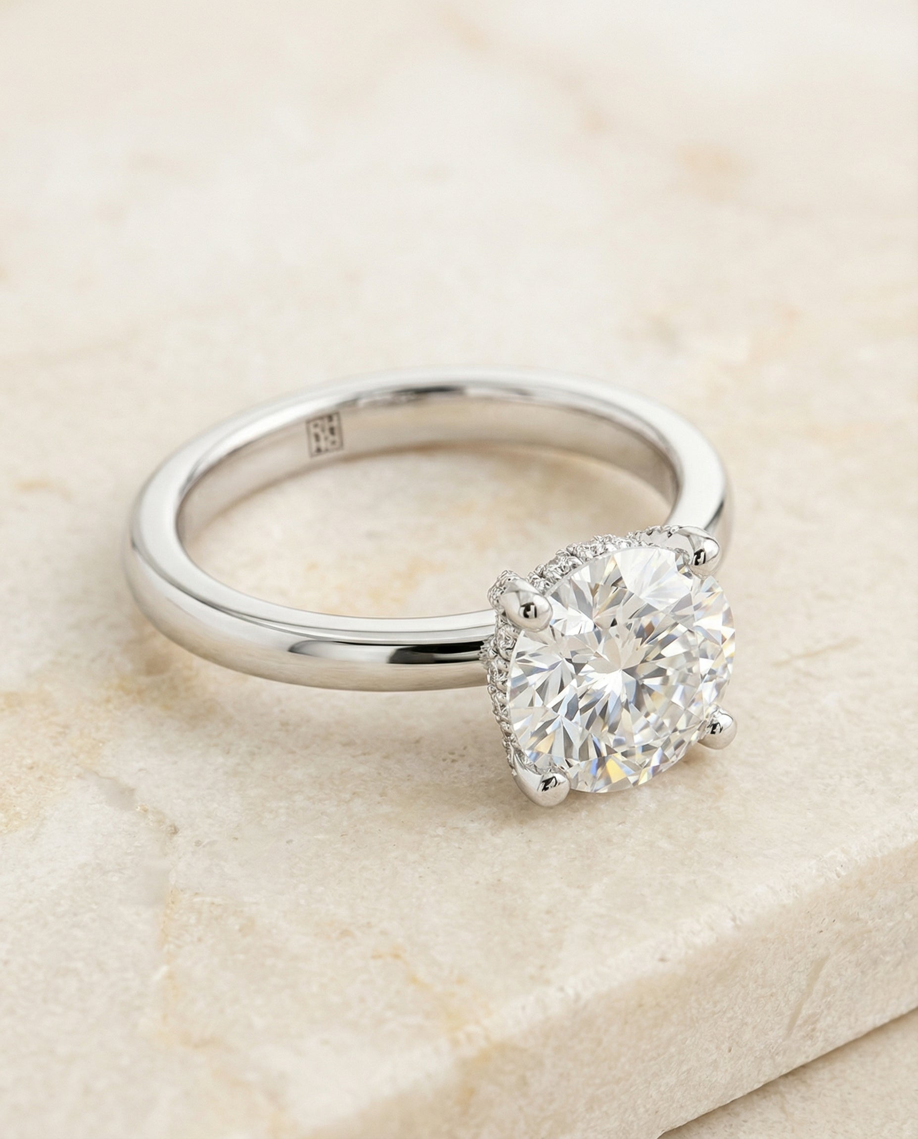Secret Halo Adorned Prong Solitaire Cut styling on The Lana cushion engagement ring setting | RockHer
