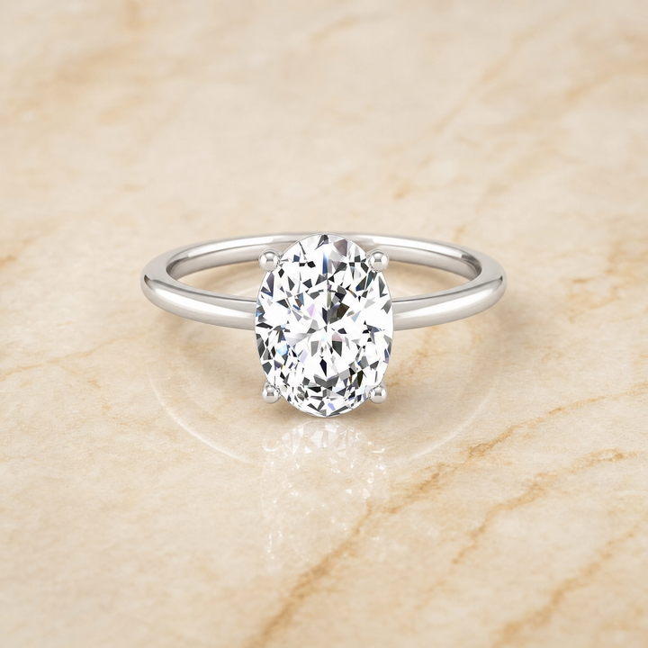 The Cyndi Curved Hidden Halo Solitaire Oval Engagement Ring Setting in Platinum