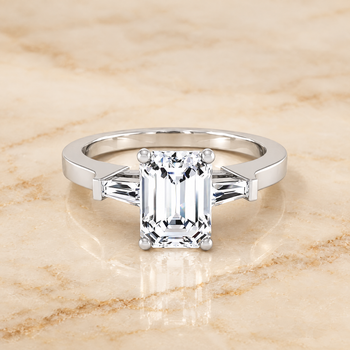 The June Three Stone Emerald Cut Engagement Ring Setting in 18K White Gold