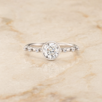 The Brandi Bezel Accent Solitaire Round Engagement Ring Setting in 18K White Gold