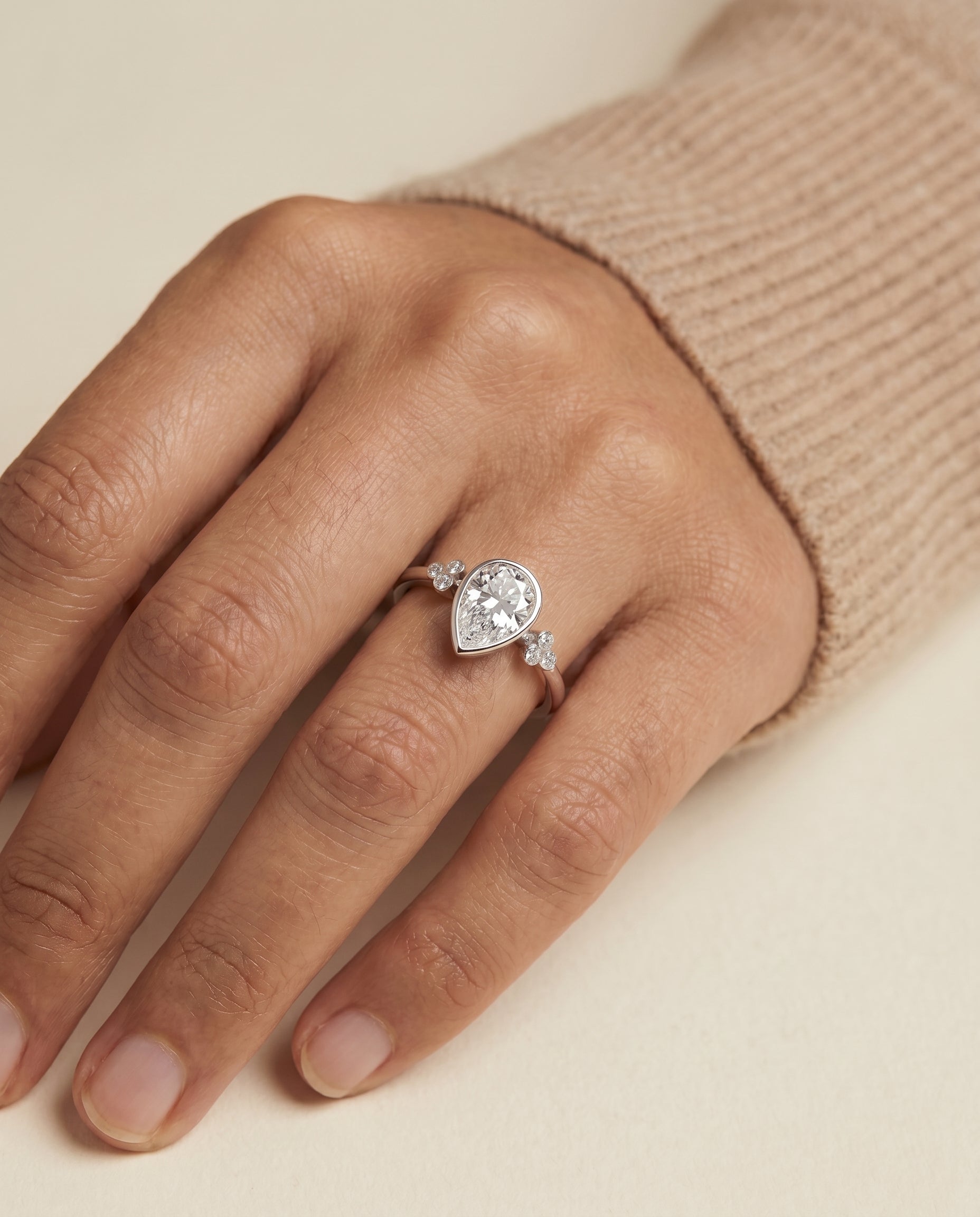 The Selena engagement ring setting in Platinum, clover bezel accent solitaire design | RockHer
