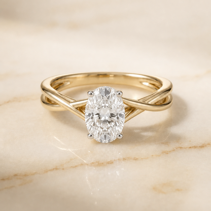 The Grace Twisted Shank Hidden Halo Solitaire Oval Engagement Ring Setting in 18K Yellow Gold