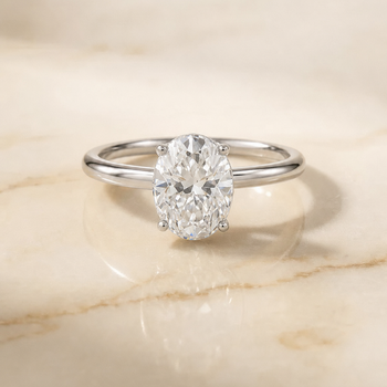 The Eartha Upper Hidden Halo Solitaire Oval Engagement Ring Setting in Platinum