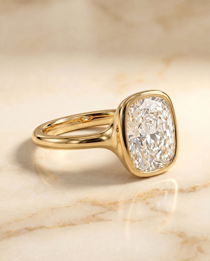 The Agnes Bezel Solitaire In Cushion Cut Engagement Ring Setting in 18K Yellow Gold