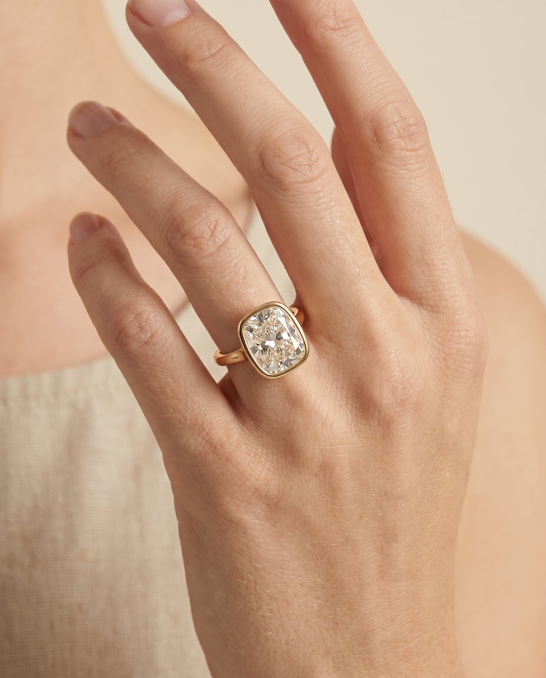 The Agnes engagement ring setting in 18K Yellow Gold, bezel solitaire in cut design | RockHer