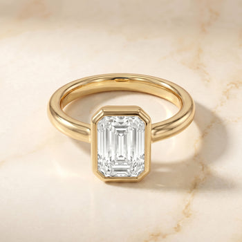 The Agnes Bezel Solitaire In Emerald Cut Engagement Ring Setting in 18K Yellow Gold